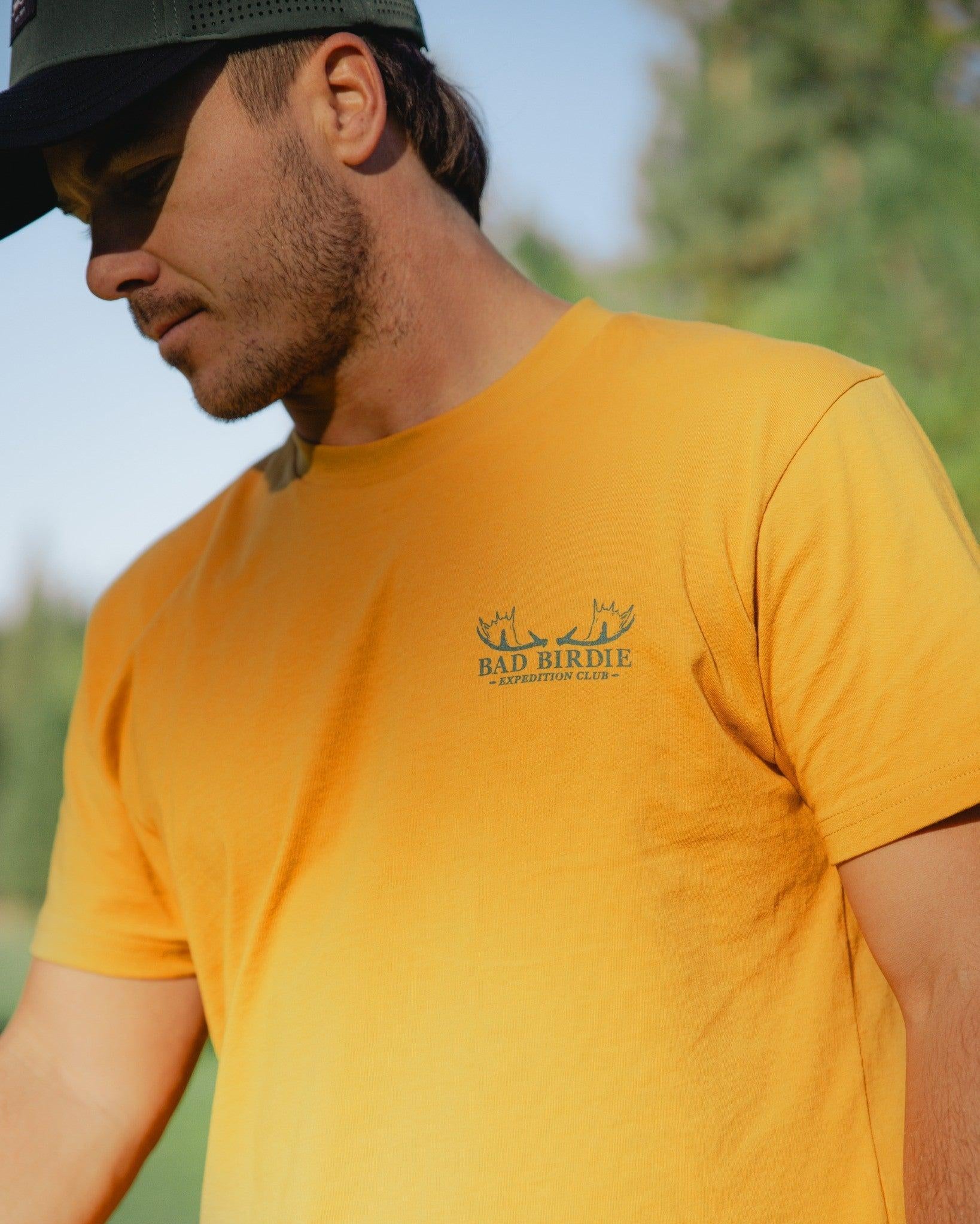 Expedition Club Graphic Tee - Spruce Yellow-Men's T-Shirt-Bad Birdie-with-Micah-Morris